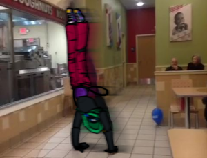An overlayed drawing of Xenos doing a back handspring in a Krispy Kreme.